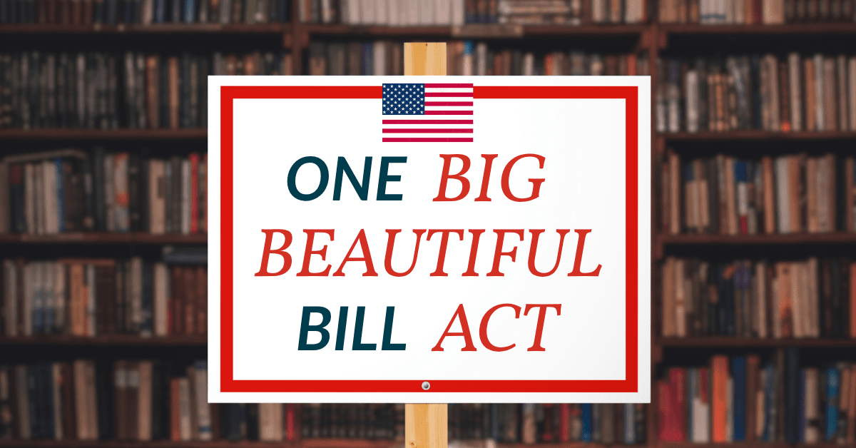 Trump's Tax Bill. Desk sign reading 'One Big Beautiful Bill Act' in front of American flags.